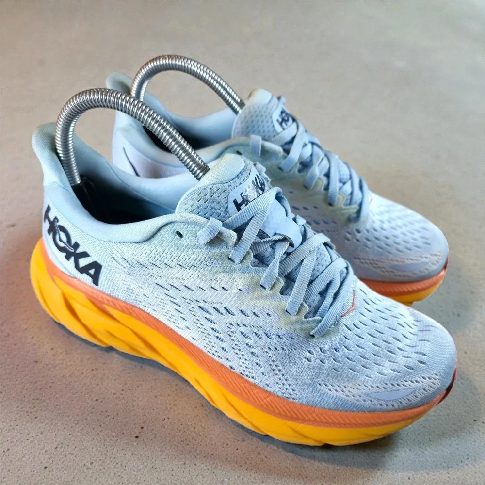 Hoka One One Women's Light Blue Running Shoes with Yellow and Orange Midsole